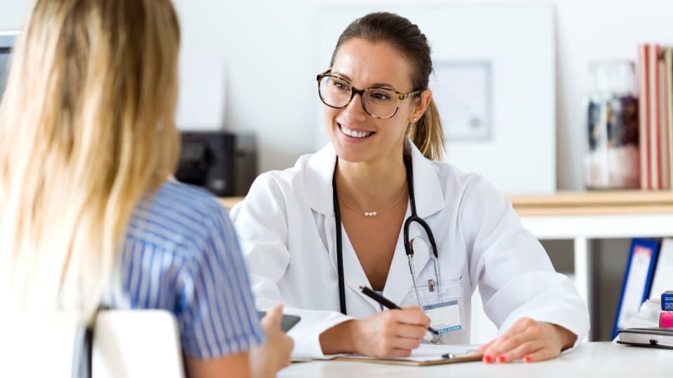 A doctor in Switzerland is consulting with a patient