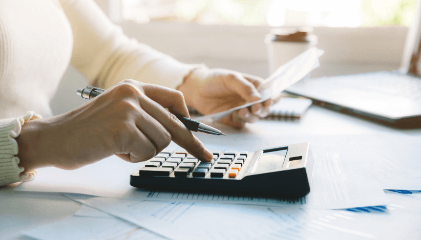 Person calculating moving costs – saving tips for relocation by using tax deductions