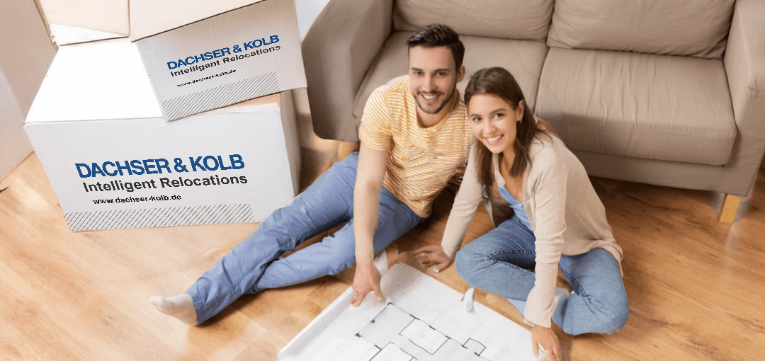 Young couple planning move with boxes – money-saving tips for moving through early organization and planning