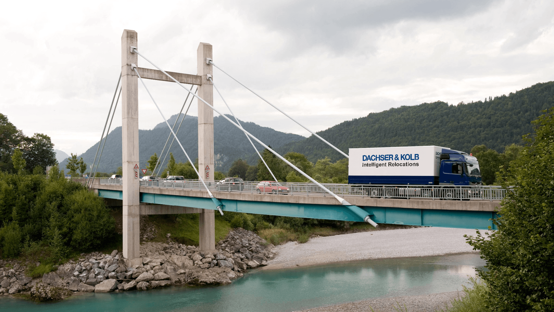 Moving truck by DACHSER & KOLB on a bridge – rent affordable moving truck for a stress-free relocation
