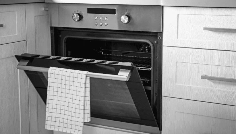 Open oven in kitchen – properly dispose of and recycle old appliances during a move