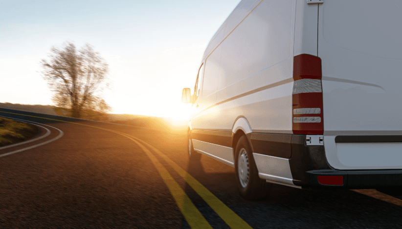 Moving van at sunrise on country road – ideal for fast disposal and recycling during a move
